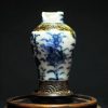 大明成化款 青花花卉纹铁锈边将军罐 （有残）