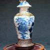 大明成化款 青花花卉纹铁锈边将军罐 （有残） - Image 2