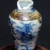大明成化款 青花花卉纹铁锈边将军罐 （有残）