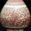 大清乾隆款 釉里红缠枝莲蒜头瓶